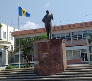 A picture of the Errol Barrow Statue in Independence Square, Bridgetown, Barbados. The statue is of Errol Walton Barrow, the first Prime Minister of Barbados. He is standing on a granite plinth and is looking out over the square.