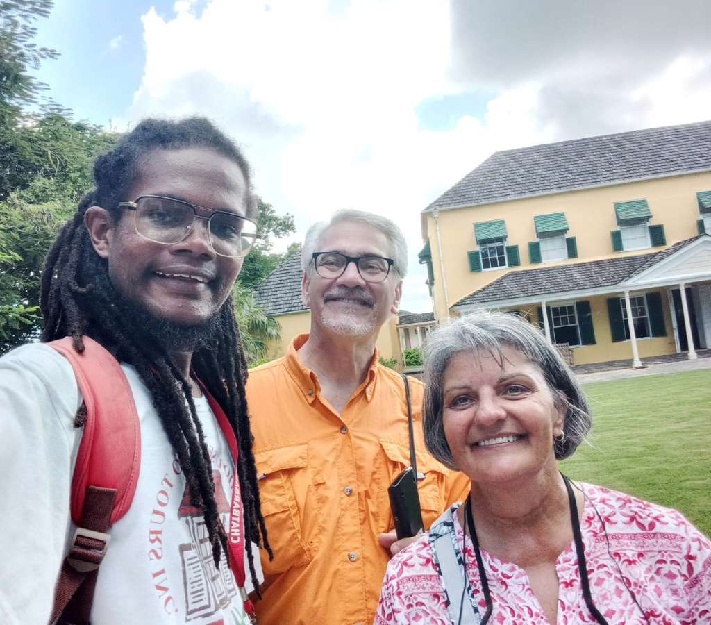 Guide and guests reflect after exploring Garrison & George Washington House, part of Chattel House Audio Tours in Barbados.